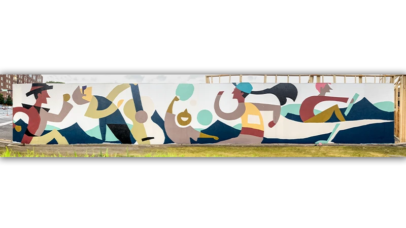 A wide shot of the completed mural painting.