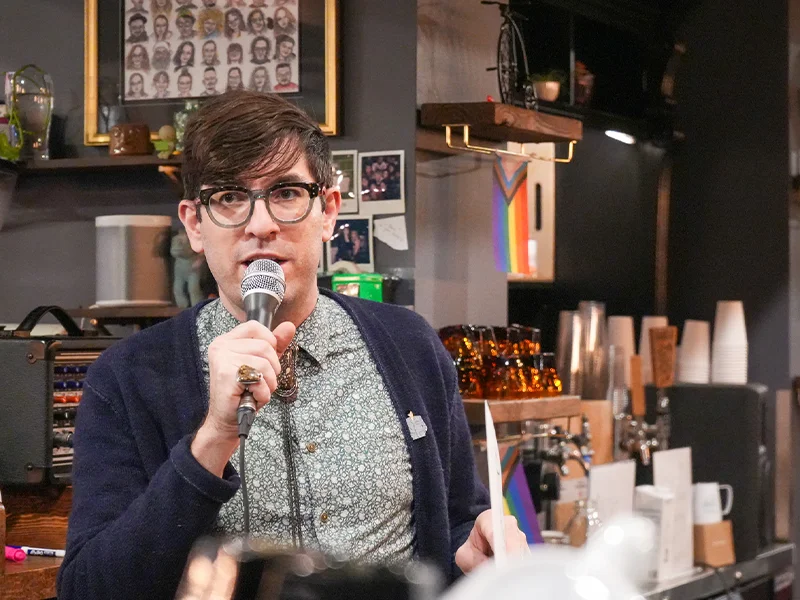 A person speaking into a microphone.