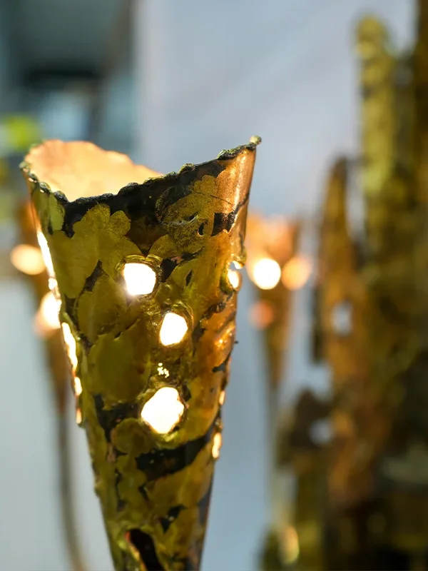 A close view of the torch cut chandelier.