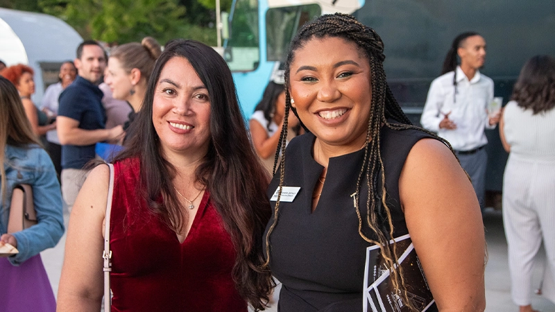 Danielle and Yeni smiling together.