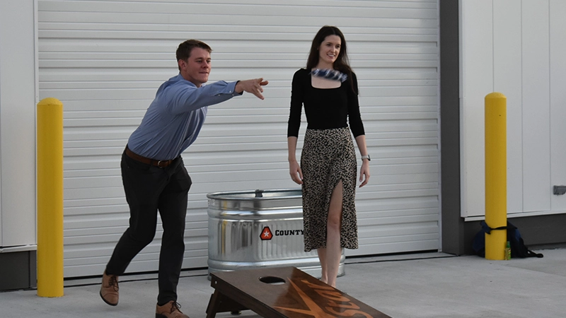 Attendee playing cornhole.